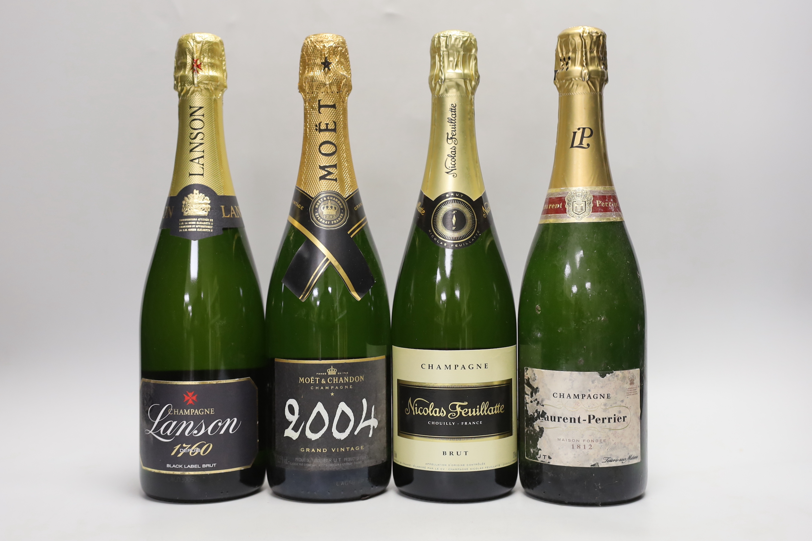 Four bottles of Champagne: 2004 Vintage Moet and Chandon, Laurent- Perrier, Brut Maison Fondee 1812, Black Label Lanson, Nicolas Feuillatte